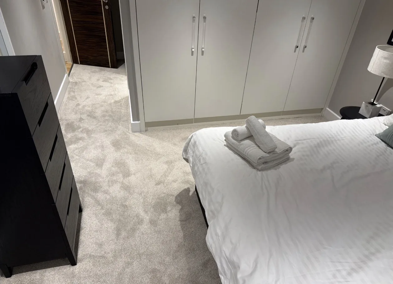Bedroom with pale carpet fitted wall to wall, the room finished and made up.